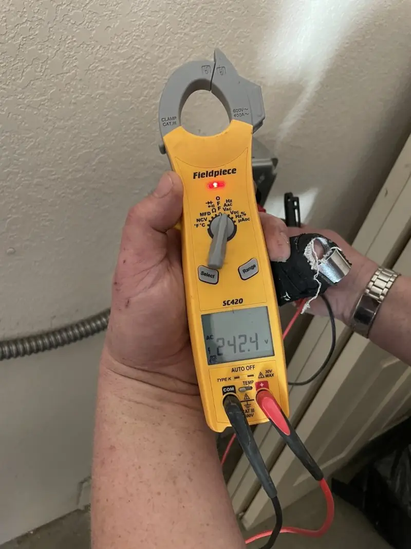 Voltage testing with clamp meter during Generator Installation in Monmouth Beach